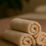 A massage room in Ploy's massage Peterborough with towels on a massage bed